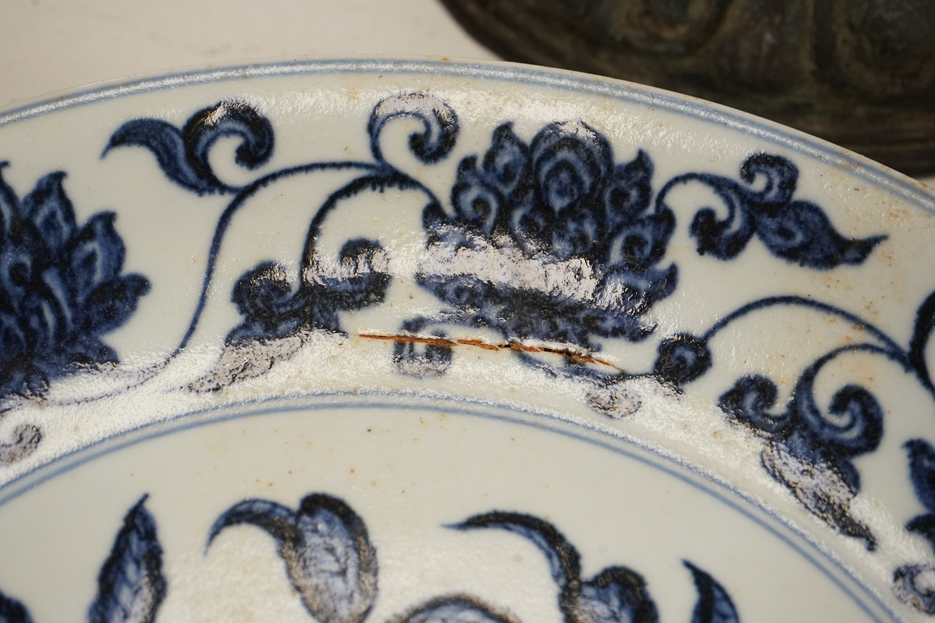 A Chinese blue and white pomegranate dish, 33cm diameter, Condition - firing crack to surface of dish